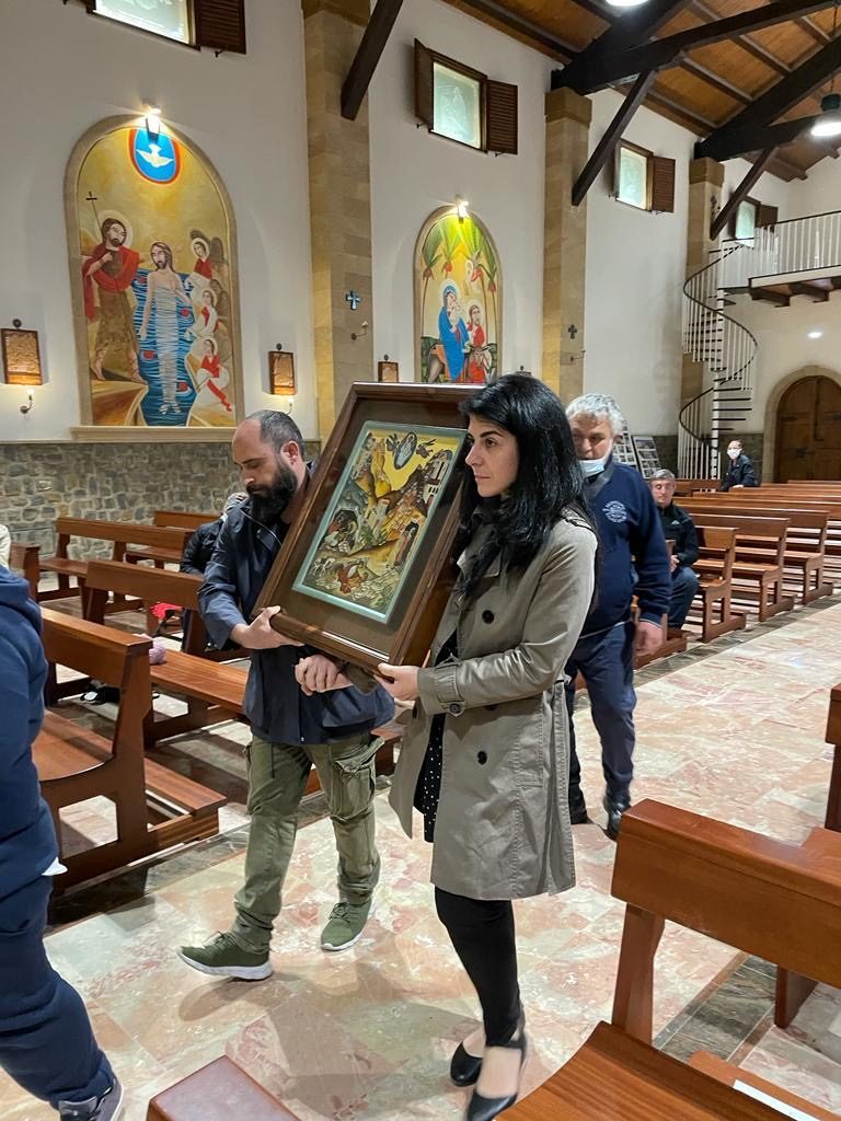 Delivery to the Mission — Concetta Basile and the tenor Ilarion carry the icon to the Mission.