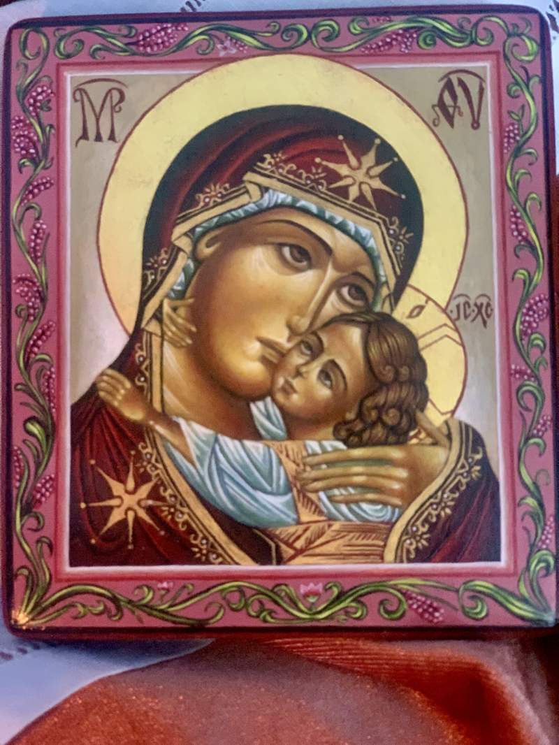 Hand-painted icon of the Mother of God of Tenderness with decorated border